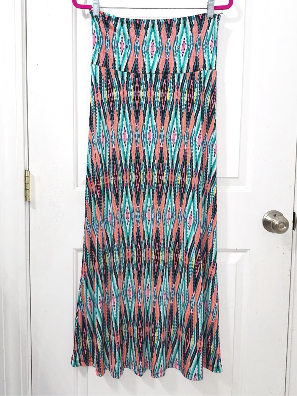Auditions long stretch maxi skirt features a vibrant turquoise & coral geometric